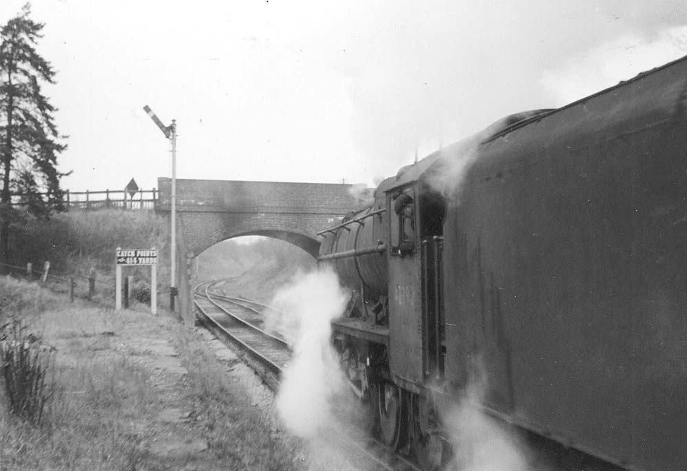 Ex-LMS 8F 2-8-0 No 48392 gets the right away from Kineton to Fenny Compton on 10th January 1964
