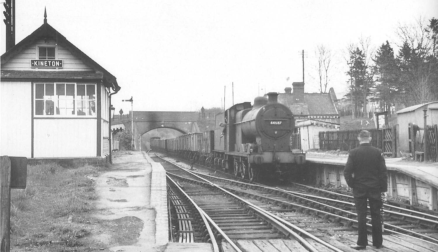The driver of ex-LMS 4F 0-6-0 No 44587 drifts towards signalman holding the staff from Fenny Compton to Kineton