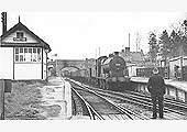 The driver of ex-LMS 4F 0-6-0 No 44587 drifts towards signalman holding the staff from Fenny Compton to Kineton