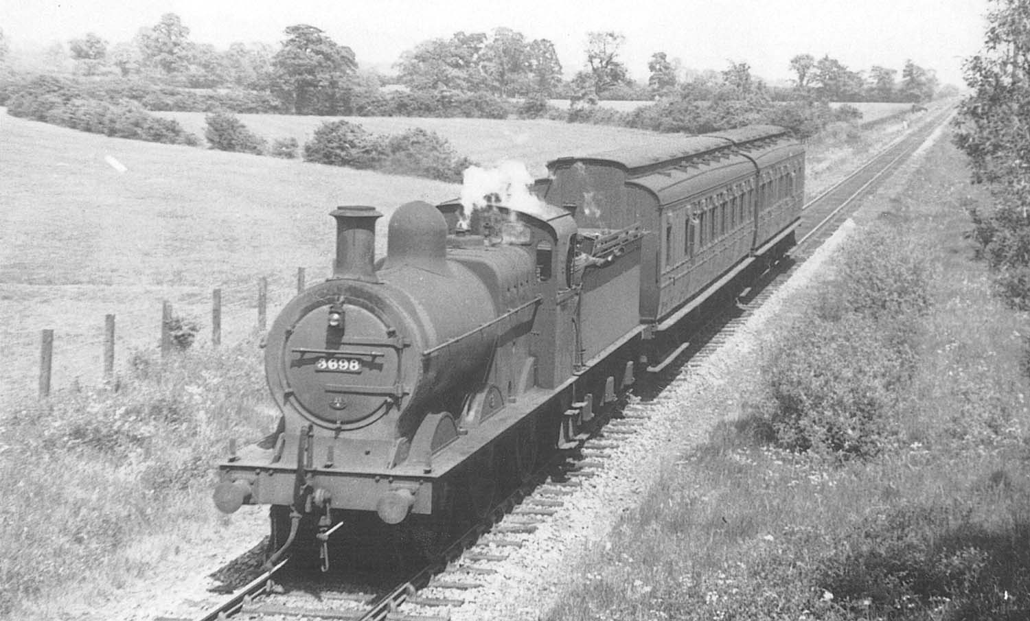 East of Kineton looking towards Burton Dassett on Boundary Farm road bridge as ex-MR 3F 0-6-0 No 3698 passes beneath