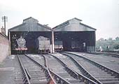 Ex-LMS 0-6-0 4F No 44587 is standing inside the shed in company with other classmates on 21st May 1956