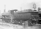 SMJ 0-6-0 No 7 complete with Beyer Peacock tender is seen stabled fully coaled and watered outside the shed