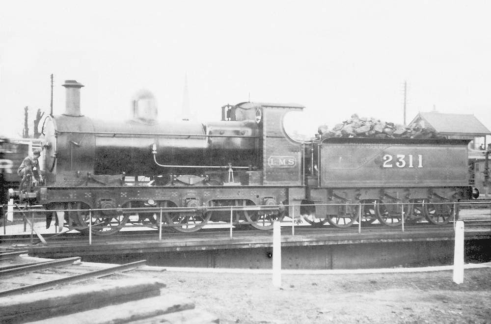 Another view of ex-SMJ 0-6-0 No 2311 formerly SMJ No 18 on the turntable at the shed 8th April 1924