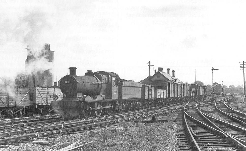 Ex-GWR 0-6-0 2251 class No 2211 is seen at the head of the 'Tiddly Dyke' as it gets ready to leave the former SMJ station via the exchange lines