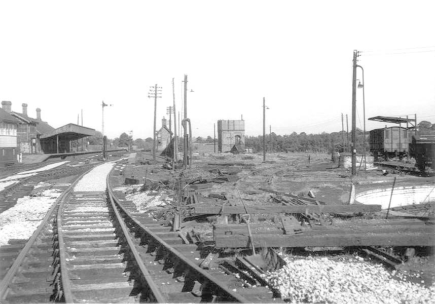 View of the site of the demolished shed at Stratford on Avon showing only the water tower tower, coal stage and water column remaining
