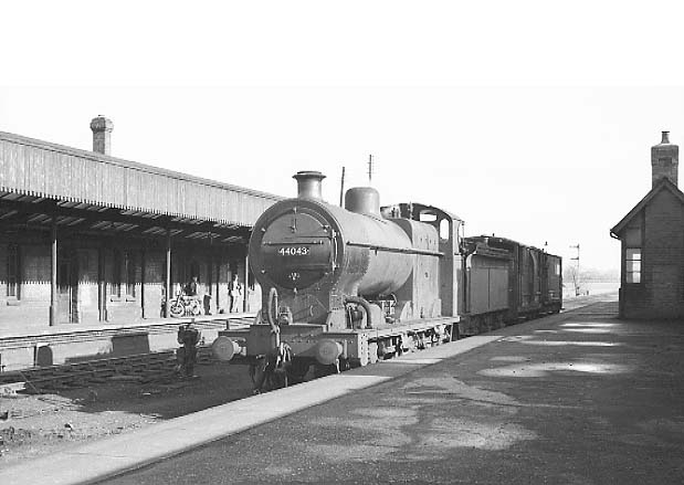 Ex-LMS 0-6-0 4F No 44043 is seen passing through Stratford on Avon station on a local pick up goods service