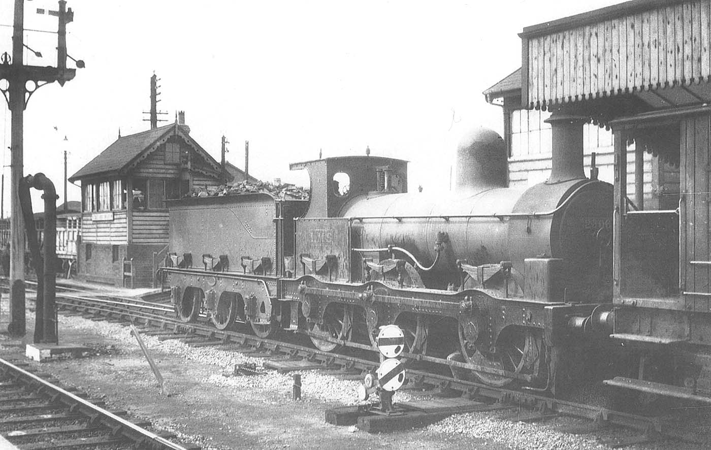 Ex-E&WJR 0-6-0 No 2306, formerly E&WJR No 12 but now in its LMS guise, is busy working within the confines of Stratford station