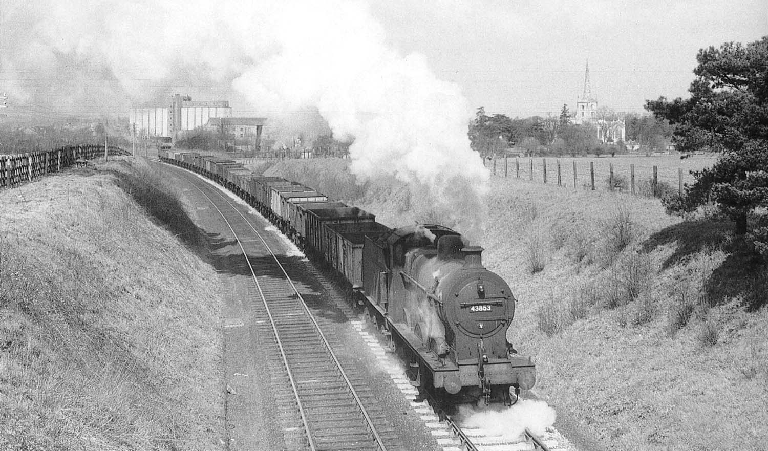 Ex-MR 4F 0-6-0 No 43853 leaves Stratford Old Town with a Class 6 service bound for Blisworth in the very early 1960s