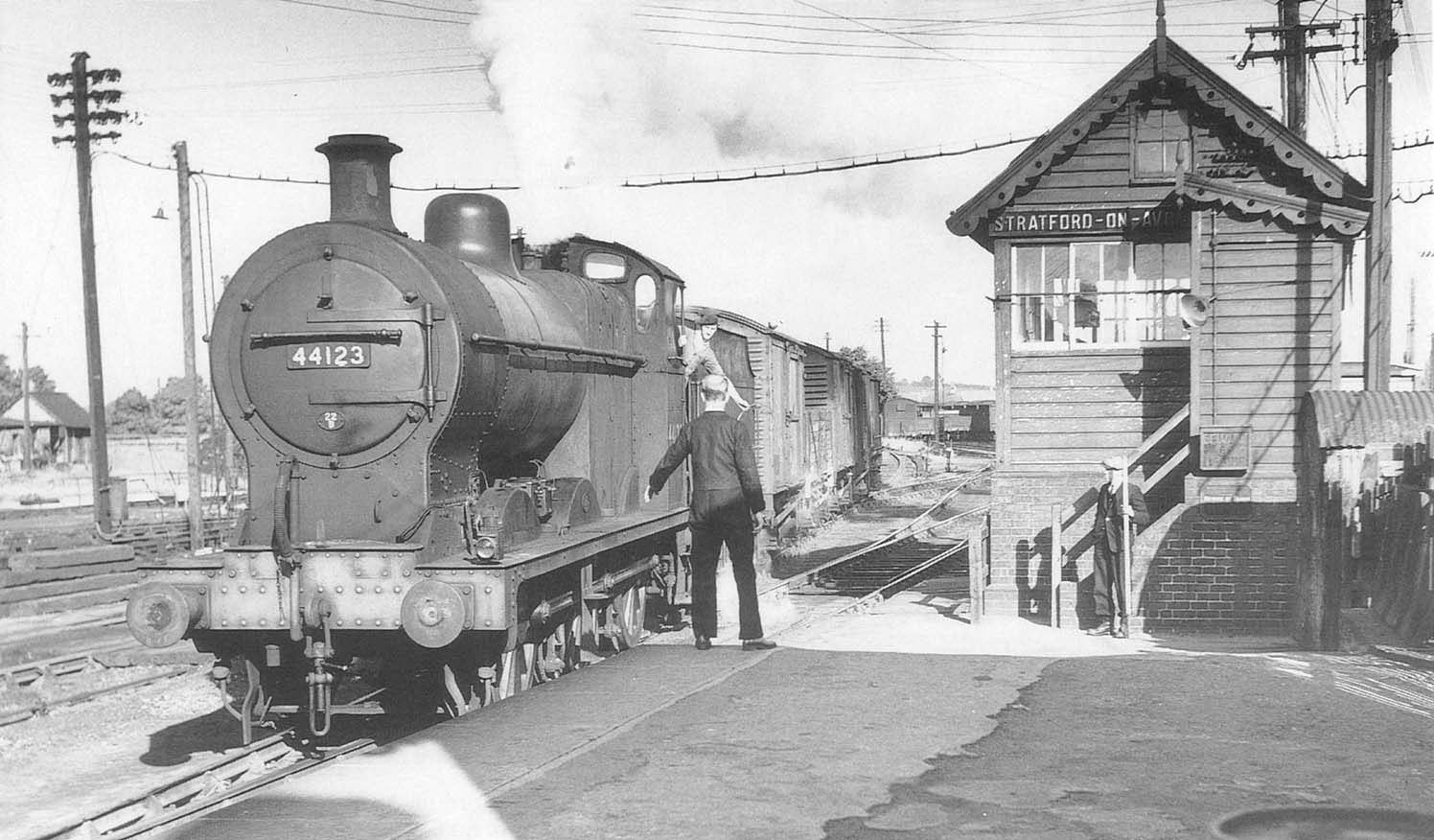 Ex-LMS 4F 0-6-0 No 44121 slows down to hand in the staff for the section from Broom to Stratford Old Town on 19th June 1954