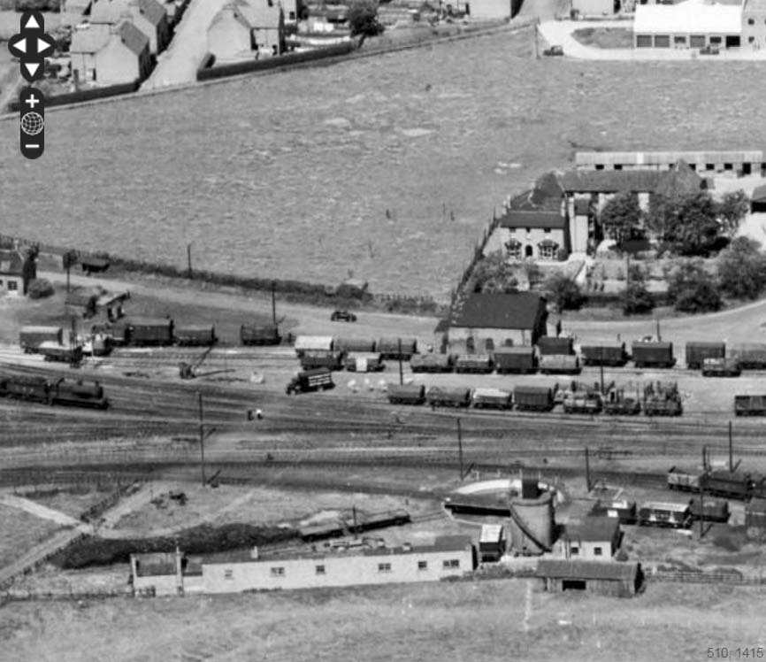 An aerial view of the westerly approach to Stratford Old Town station, goods yard and shed on 23rd June 1952