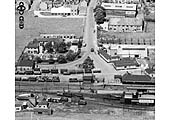 Close up showing the entrance to the station and a mix of wagons adjacent to the goods shed on 23rd June 1952