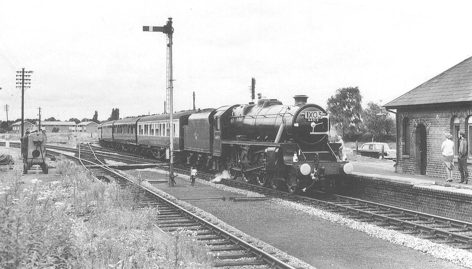 Ex-LMS 5MT 4-6-0 No 44919 enters the former SMJ station with the empty rolling stock of the royal train on 11th July 1964