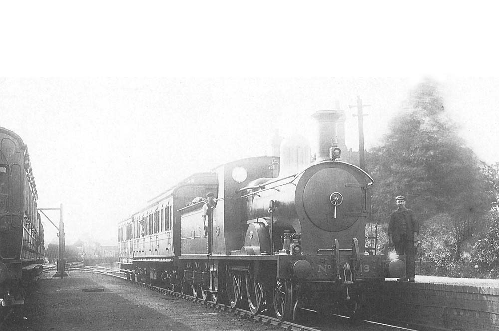 E&WJR 2-4-0 No 13 with a two coach train, waits at Straford upon Avon in East & West Junction Railway days