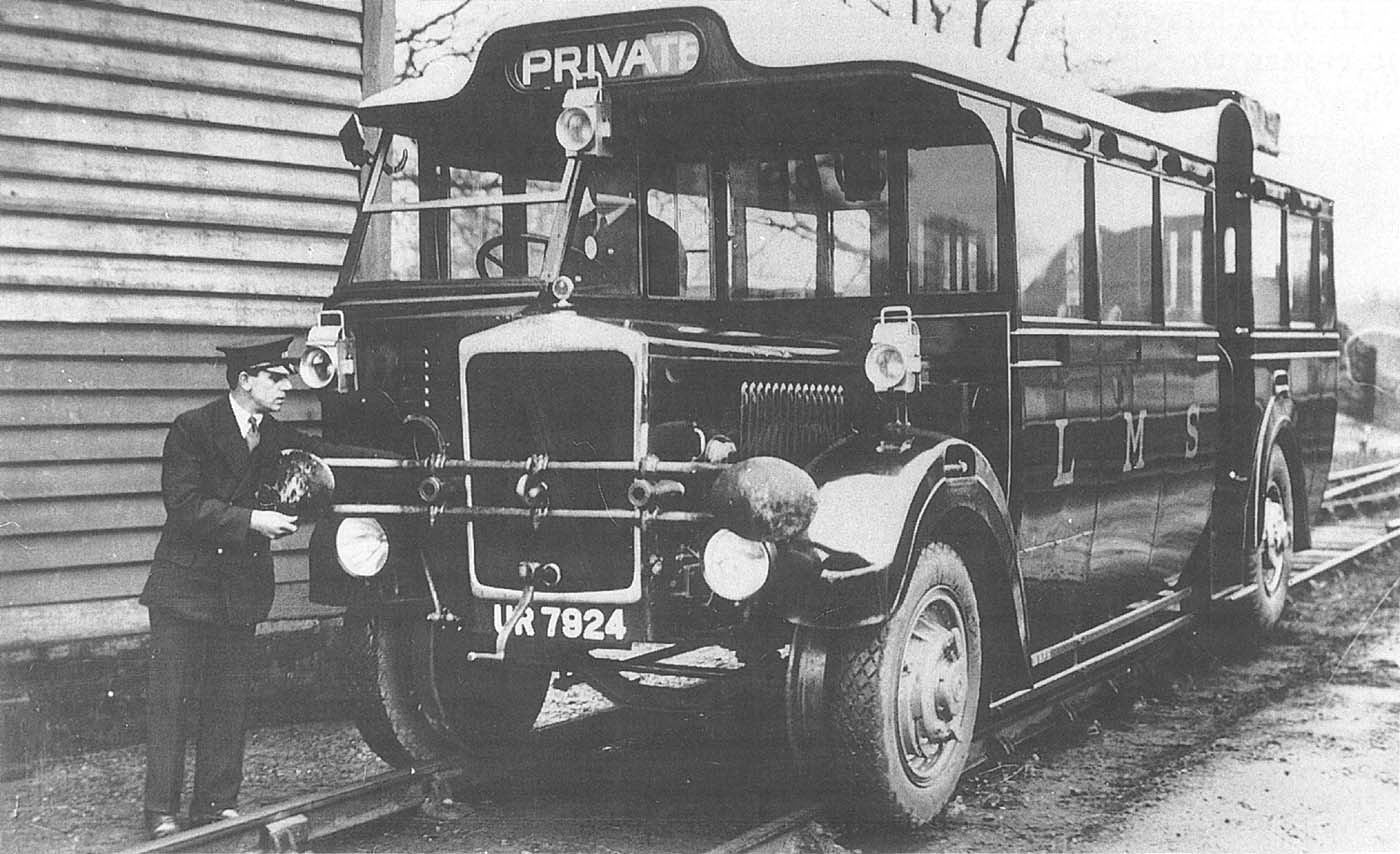 A member of the LMS' staff checks the Ro-Railer's temporary buffing heads and a draw hook