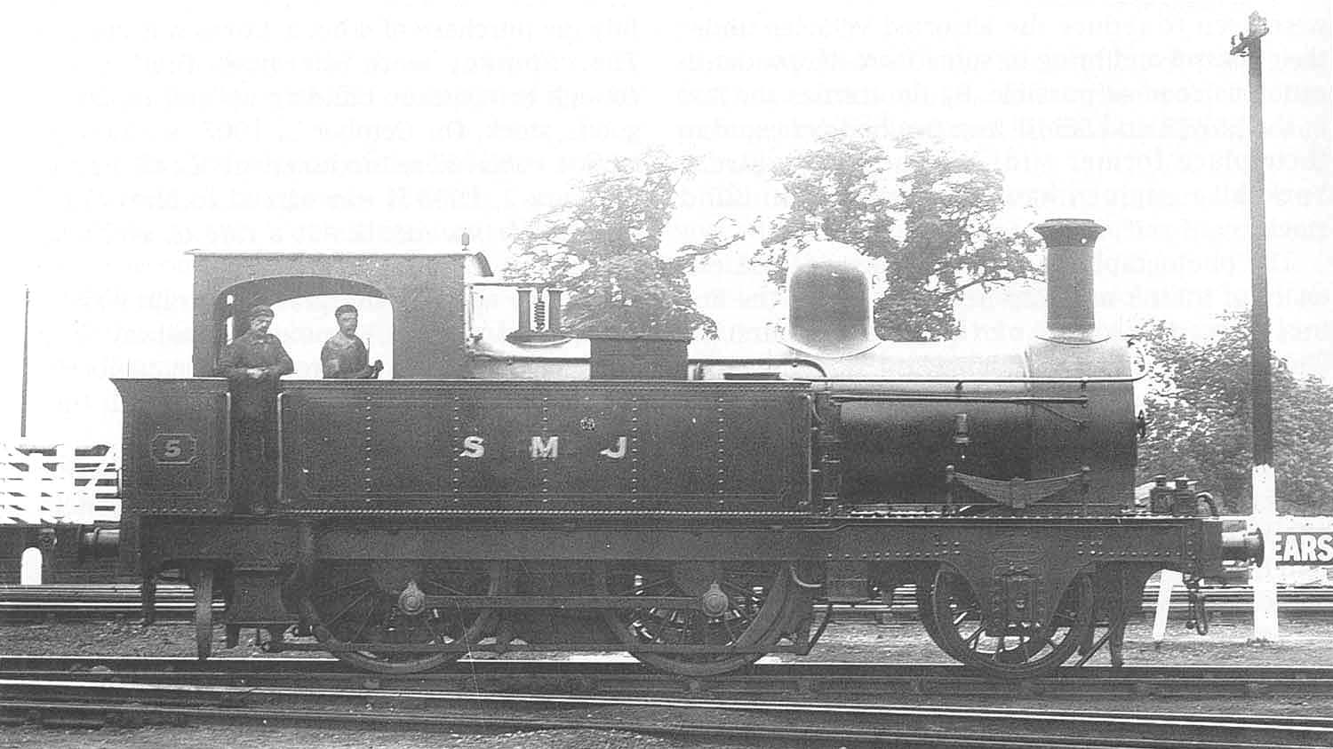 SMJ 2-4-0 No 5, one of the locomotives from the E&WJR days, is seen standing outside the shed with the cattle dock behind