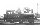 SMJ 2-4-0 No 5, one of the locomotives from the E&WJR days, is seen standing outside the shed with the cattle dock behind