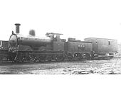 E&WJR 0-6-0 No 7, a former LNWR 'DX Goods' locomotive, with a tool van in tow outside the shed