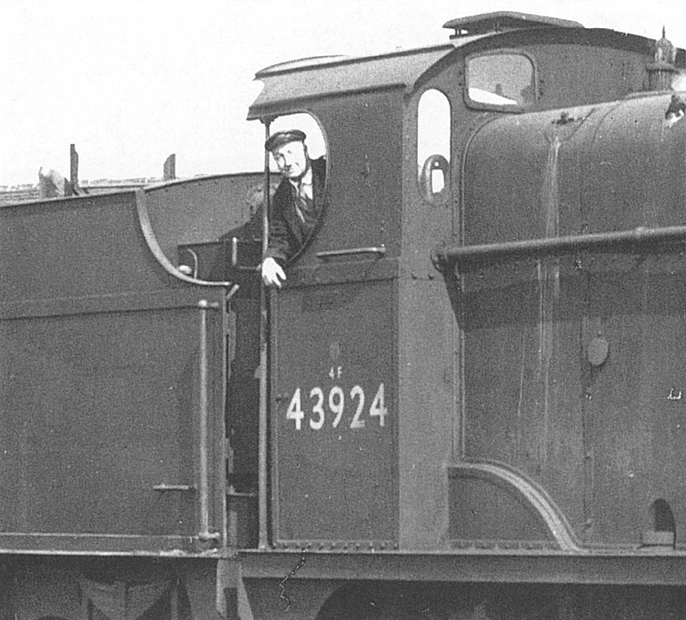 Driver T Hine poses for the camera as he looks out from the footplate of ex-LMS 4F 0-6-0 No 43924