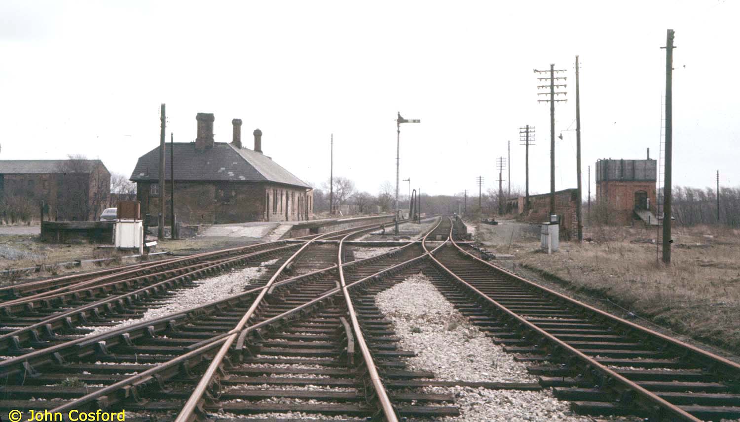 Looking east towards the former station with both sets of rails still in use as evident from the lack of rust