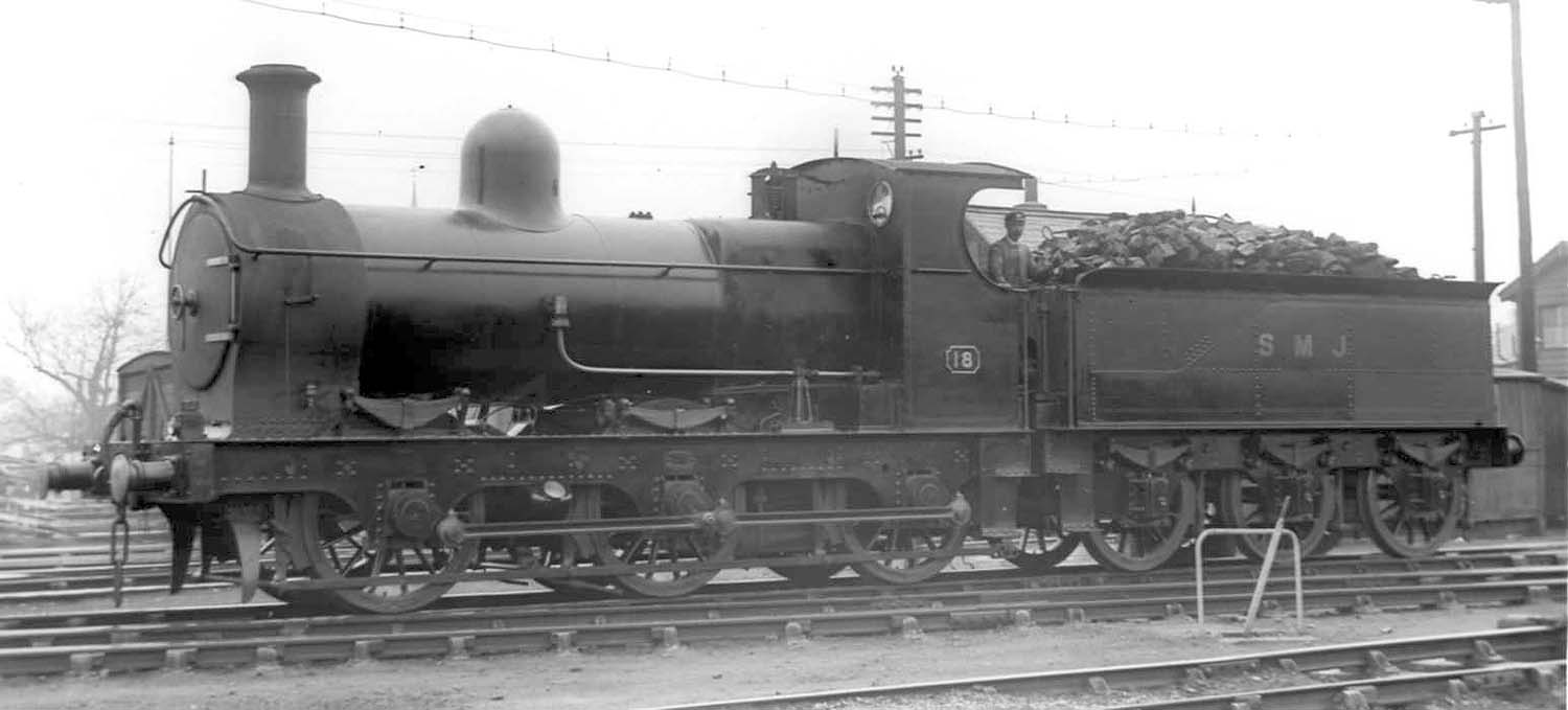 Ex-E&WJR 0-6-0 No 18, now in SMJ livery, is seen coming off shed ready for its next turn of duty