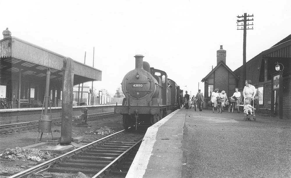 Ex-MR 3F 0-6-0 No 43693 is seen at the head of a local passenger train arriving from Towcesterin the 1950s