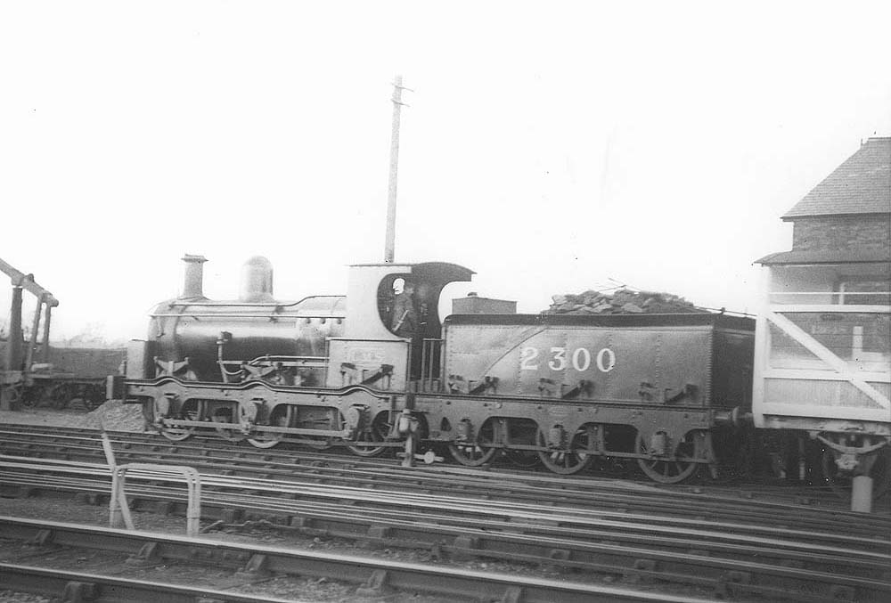 Ex-E&WJR 0-6-0 No 2300, formerly SMJ No 2, is seen in Stratford on Avon goods yard marshalling goods wagons