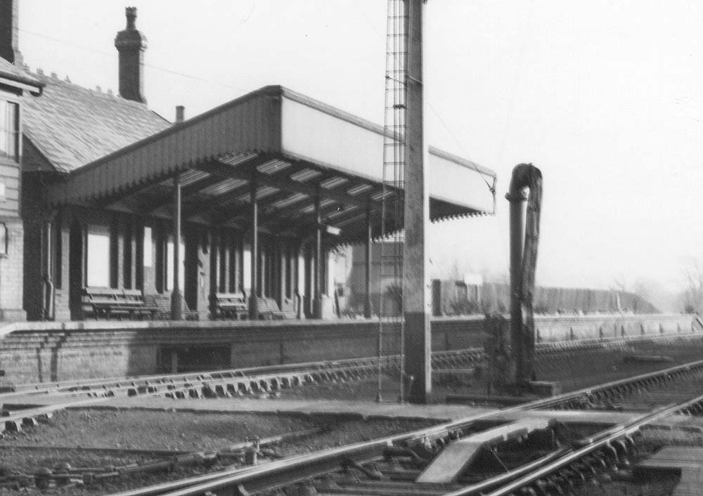 Close up showing Stratford on Avon station's up platform and the various furniture, posters and architecture on display