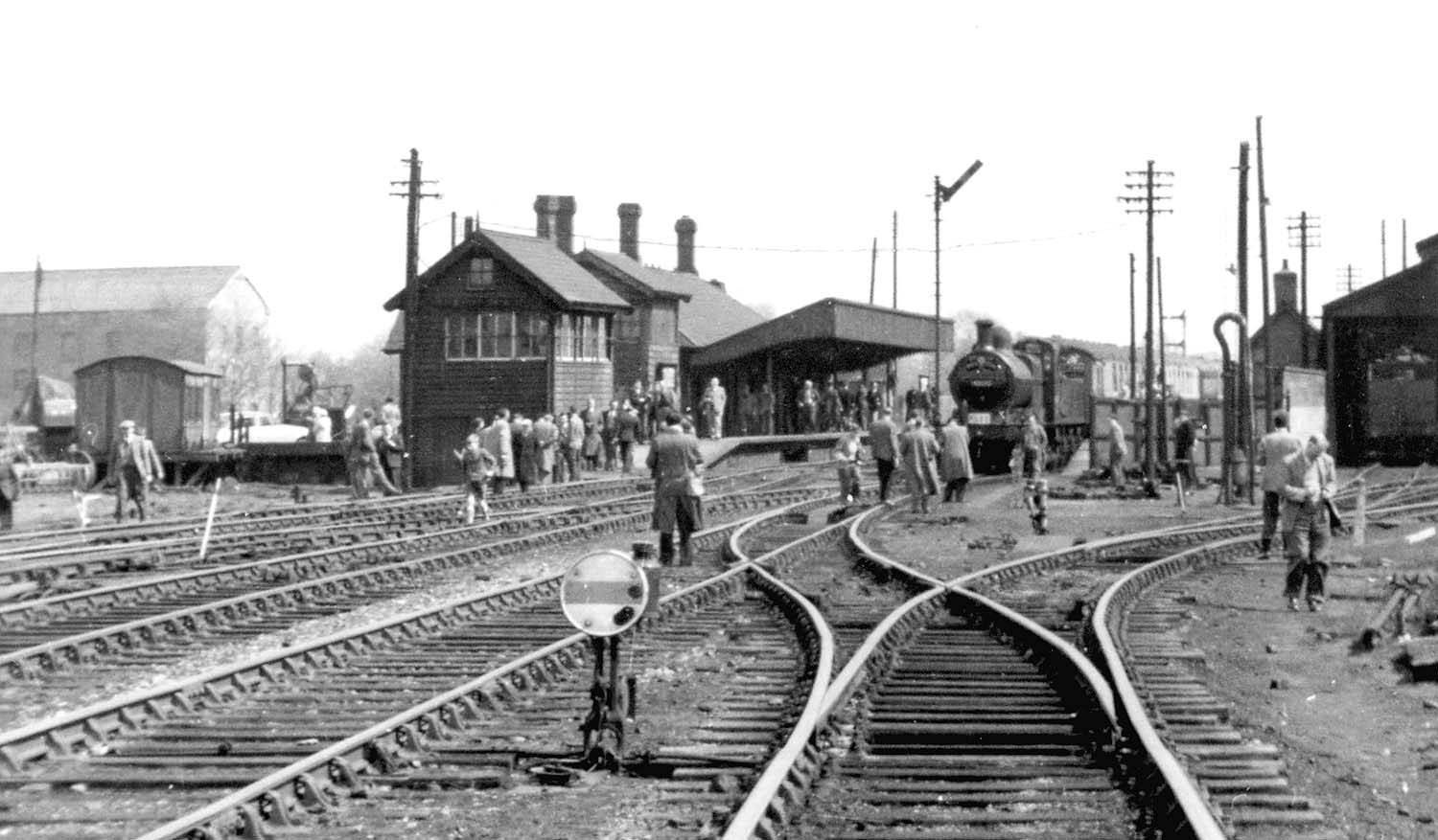 Close up showing the two signal boxes and goods yard on the left and the approach road to the shed on the right