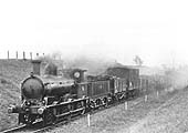 Ex-LNWR 0-6-0 DX Goods, now allocated SMJ No 7, is heading a Class 5 express goods at Woodford West in 1915