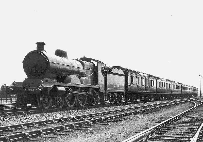 Ex-Great Central 4-4-2 Class C4/2 No 5362 passes Braunston & Willoughby on a down express comprising GWR coaching stock circa 1928