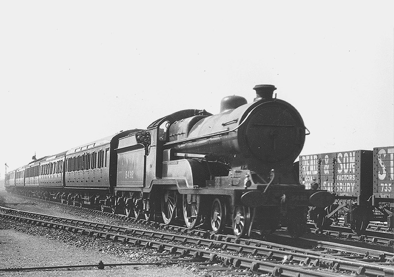 Ex-Great Central 4-4-0 Class D10 No 5432 'Sir Edward Fraser' passes through the station on an up express circa 1928