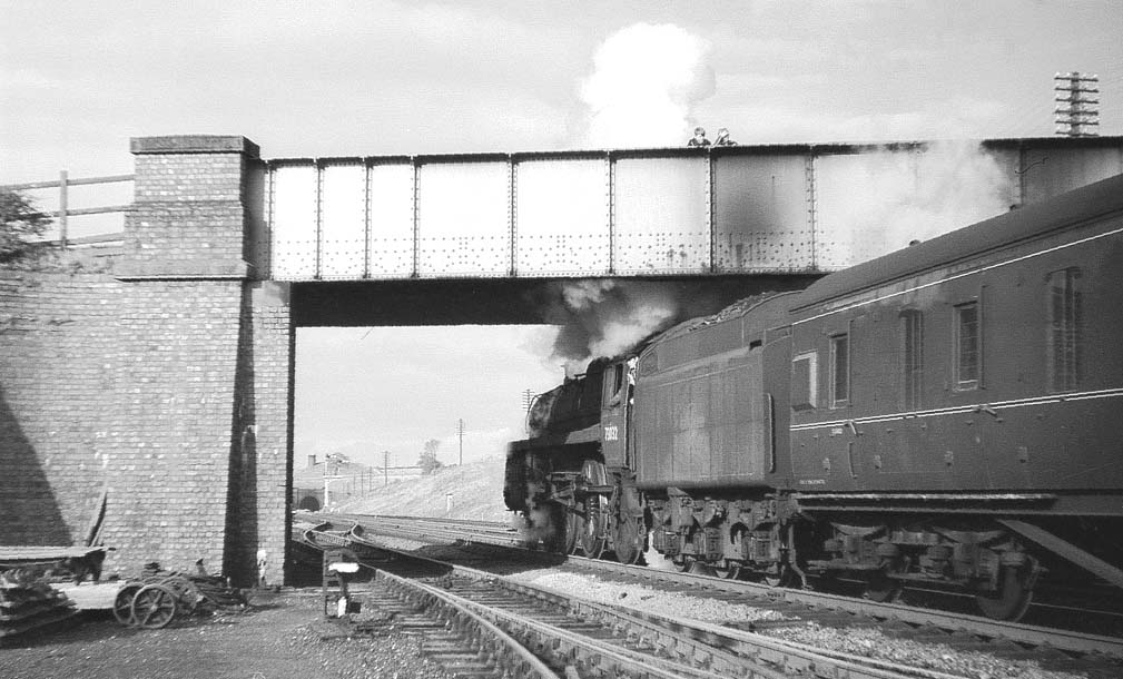 British Railways Standard Class 5 4-6-0 No 73032 is seen starting away from Charwelton with the south portal of Catesby tunnel just  visible in the distance