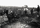 A team of navvies take a short break from their work in order to pose for Newton's camera