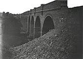 Looking from the embankment along the 13 arches of completed Great Central viaduct at Willoughby