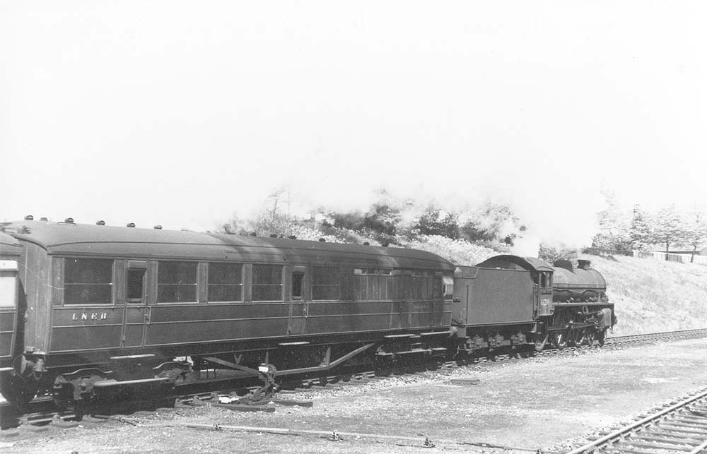 British Railways built B1 4-6-0 No 61299 is seen departing Rugby Central with an up express to London