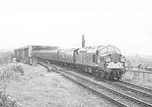 An unidentified British Railways English Electric Type 3 Diesel Electric locomotive is seen crossing the Birdcage bridge