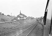 Looking towards Leicester with the overgrown entrance to Rugby Central's goods yard on the left of the signal cabin