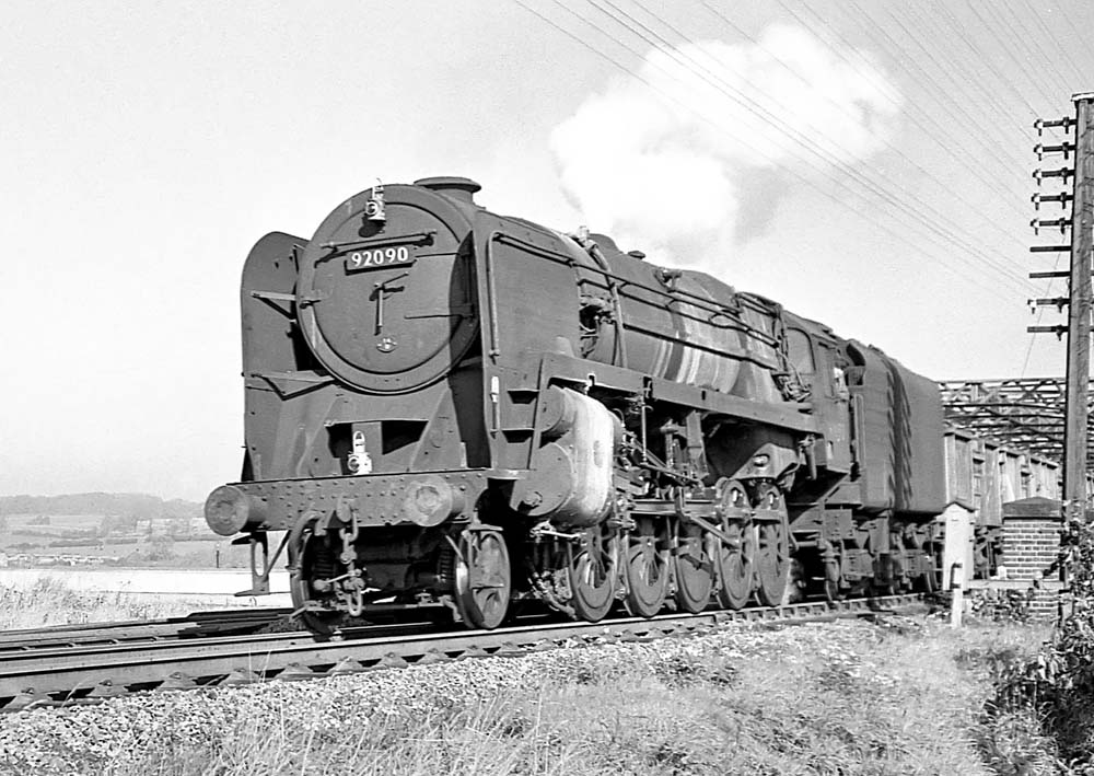 British Railways Standard Class 9F 2-10-0 No 92090 heads an up mineral train over the GCR's Birdcage bridge on 12th October 1963