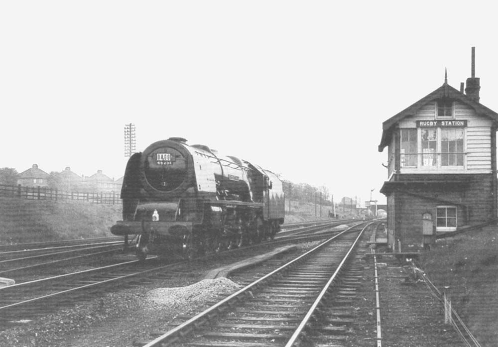 Ex-LMS 4-6-2 No 46251 City of Nottingham runs light engine past Rugby Station Signal Cabin