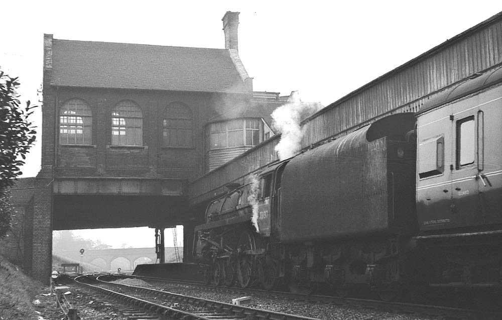 A Caprotti fitted British Railways Standard Class 5 4-6-0 No 73137 is seen on a down working at Rugby Central
