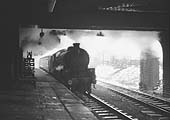 A grimy ex-LNER B1 4-6-0 No 61205 restarts at 2:00pm with a northbound local on Thursday 31 January 1963