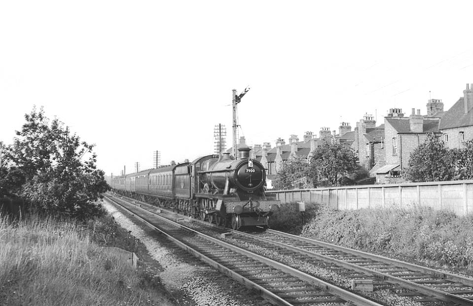 British Railways built Modified Hall 4-6-0 No 7900 'St Peter's Hall' is returning southward on the evening Leicester to Woodford Halse local passenger service