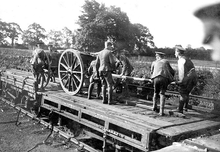 A horse-drawn Howitzer Battery is seen being loaded on to special wagons at Rugby Great Central station on 11th August 1914