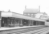Close up showing the glazed covered walkway providing access from the booking hall down to the platform