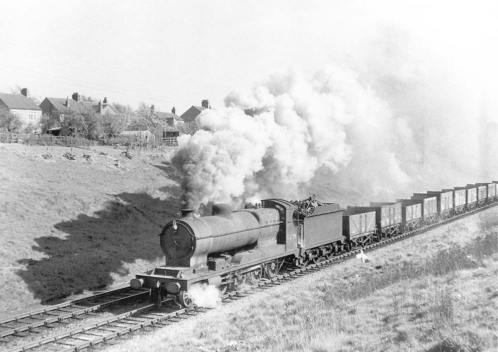 Ex-ROD 2-8-0 class O4/3 No 63739 is seen working hard on an up empty mineral train just south of Rugby station