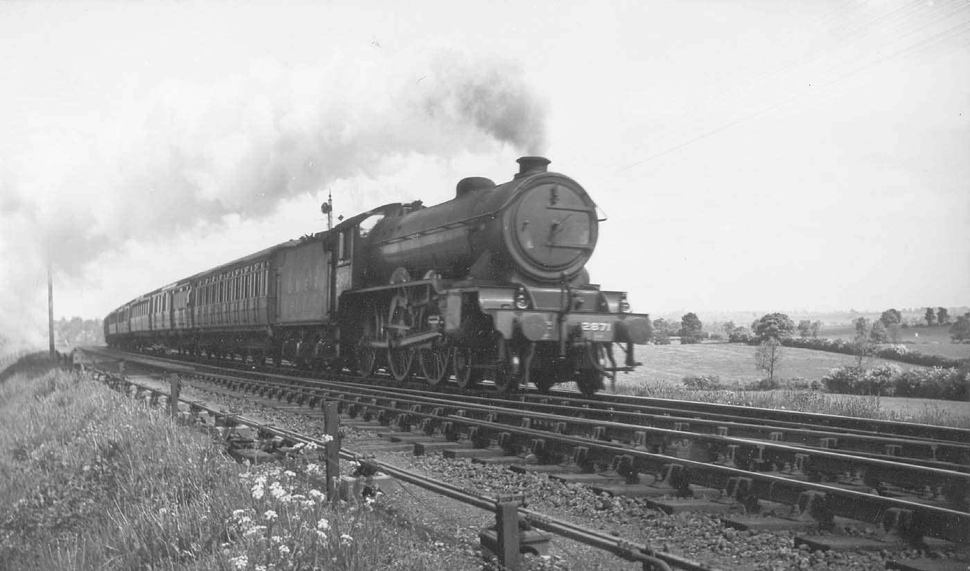 LNER 4-6-0 Class B17/4 No 2871 'Manchester City' races along at the head of a down express service circa 1946