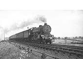 LNER 4-6-0 Class B17/4 No 2871 'Manchester City' races along at the head of a down express service circa 1946