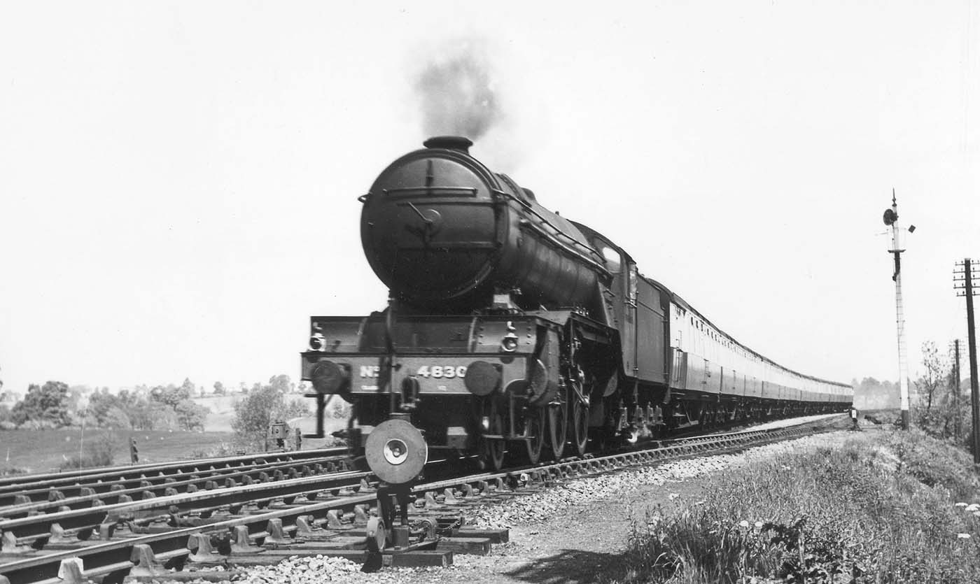 LNER 2-6-2 Class V2 No 4830 is seen heading a down passenger train past the down refuge siding near Staverton Road circa 1946