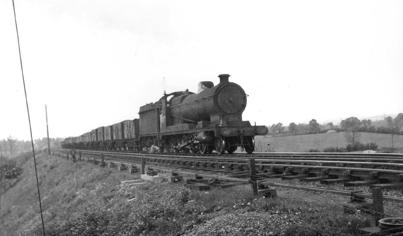 Ex-ROD 2-8-0 Class O4/7 No 6572 is seen without a breath of smoke whilst at the head of a long coal train