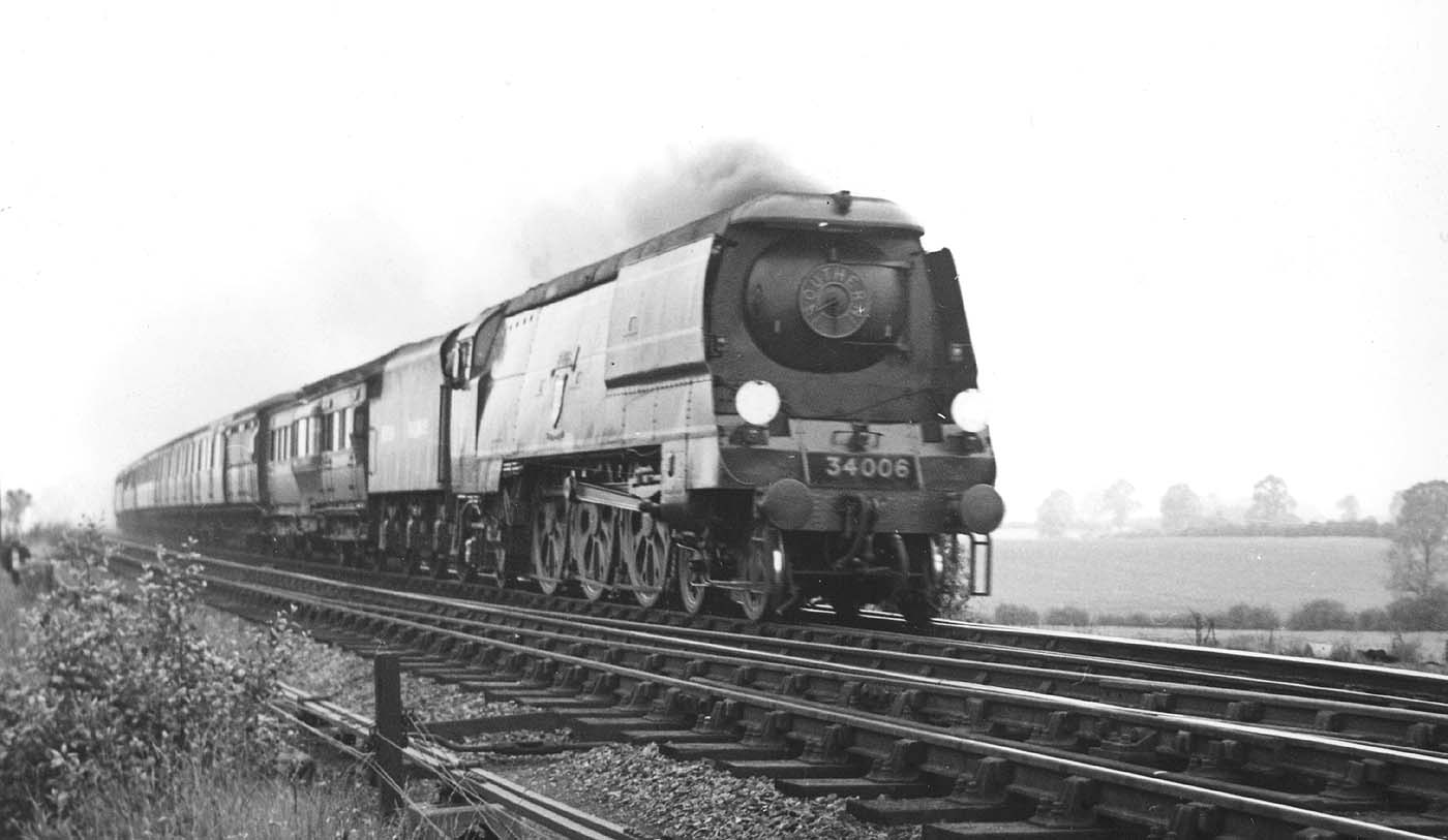 Ex-SR 4-6-2 West Country class No 34006 'Bude' is seen with LMS tender on a down express during the 1948 locomotive exchanges